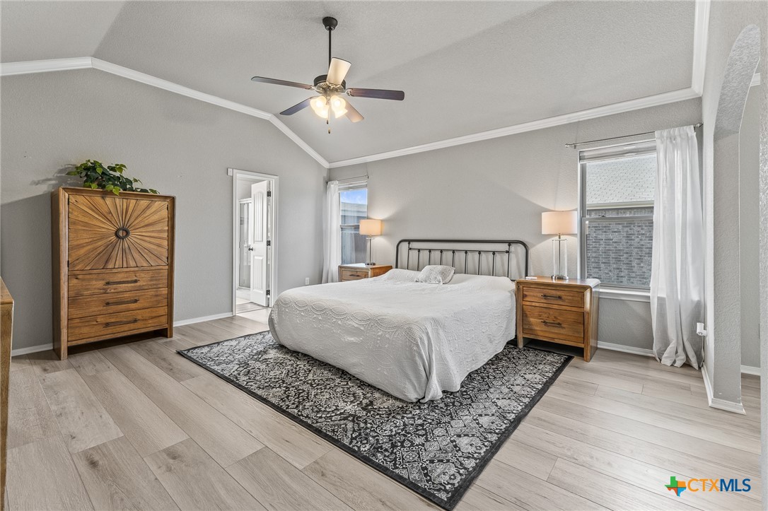 3437 Samuel Street Copperas Cove, TX 76522 - Photo 21 of 31 a bedroom with a bed and a chandelier