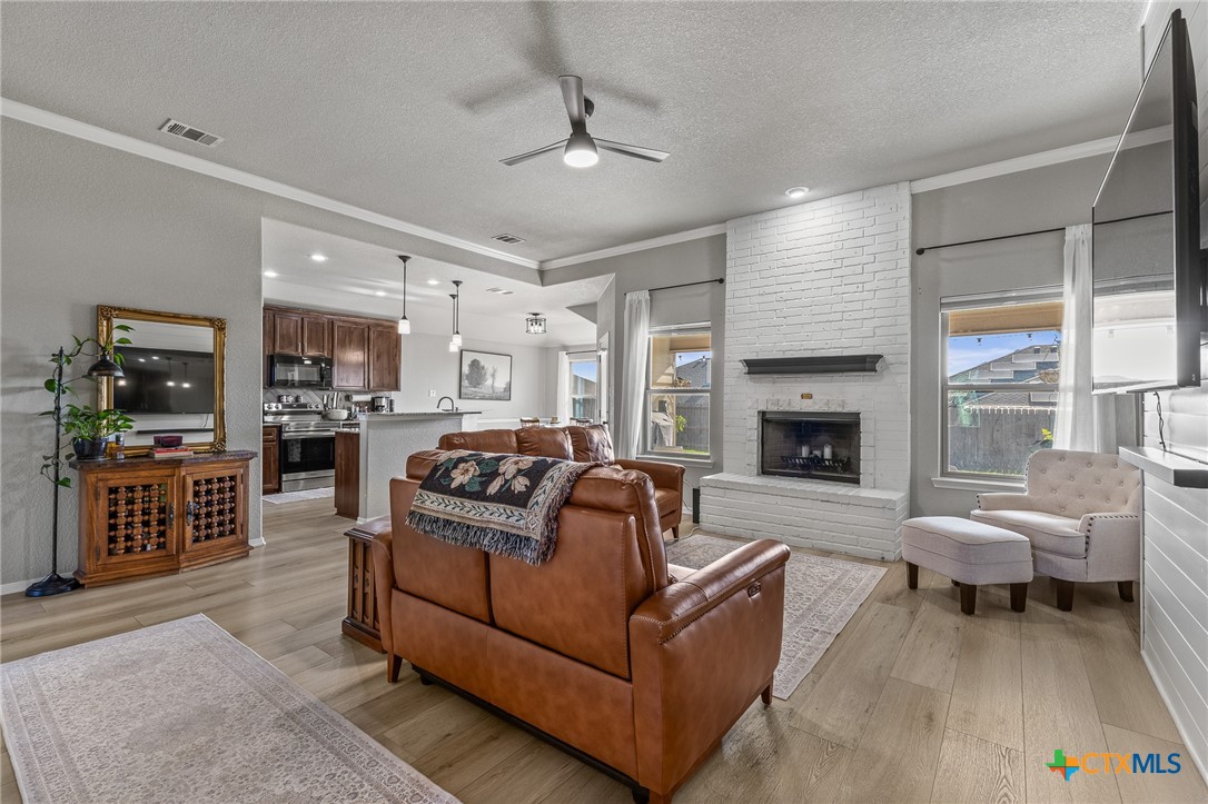 3437 Samuel Street Copperas Cove, TX 76522 - Photo 6 of 31 a living room with furniture and a fireplace