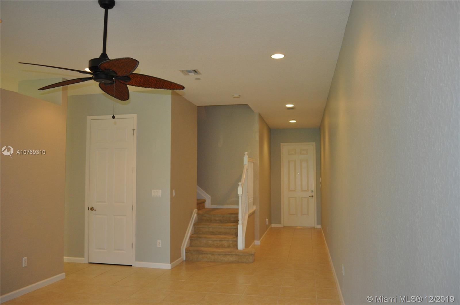 332 Southwest Otter Run Place, Unit 332 Stuart, FL 34997 - Photo 2 of 24 Foyer leads into the living area which has tile floors. Carpeted stairs take you to the second floor.