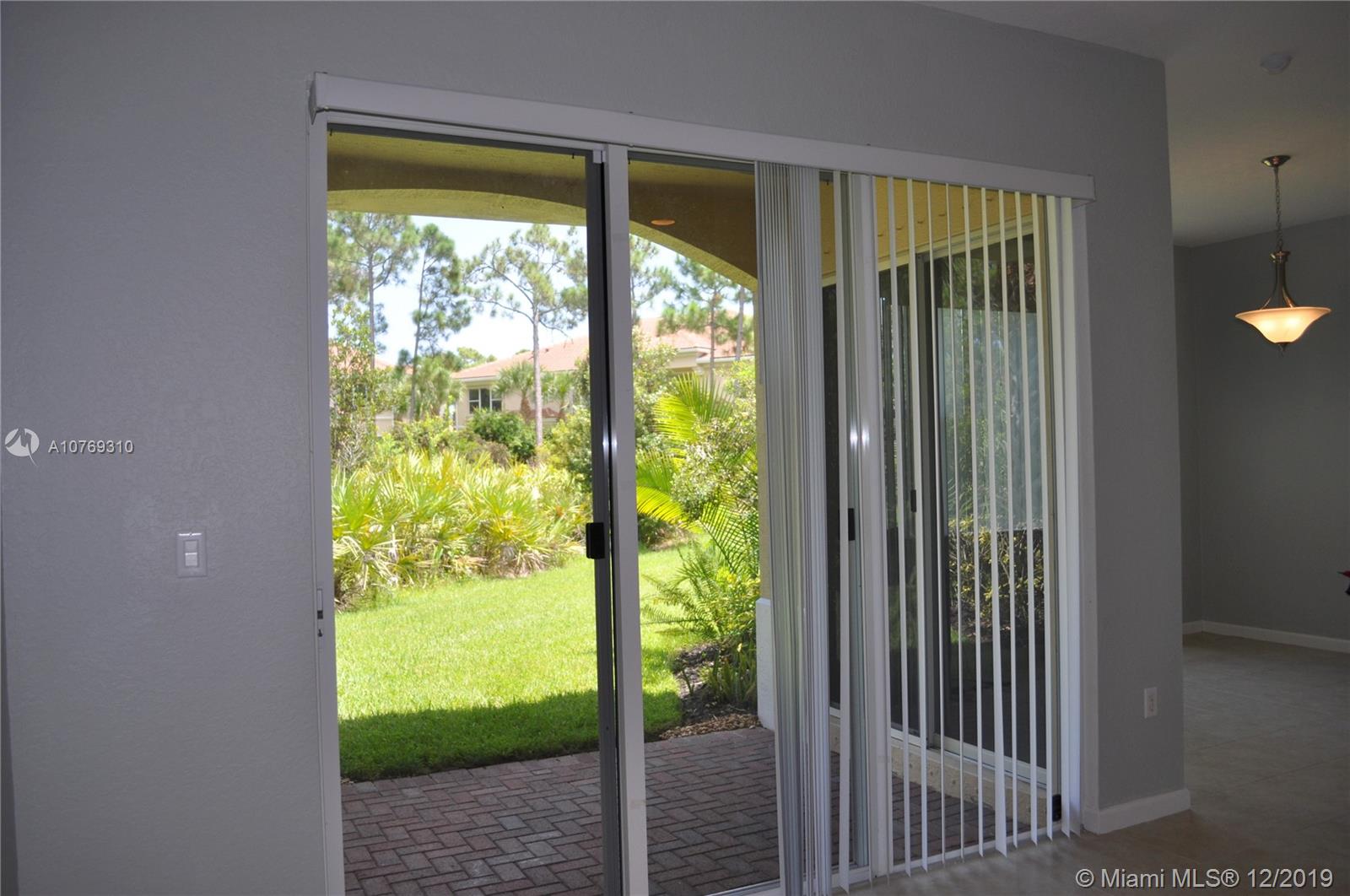 332 Southwest Otter Run Place, Unit 332 Stuart, FL 34997 - Photo 20 of 24 Easy access to the private patio.