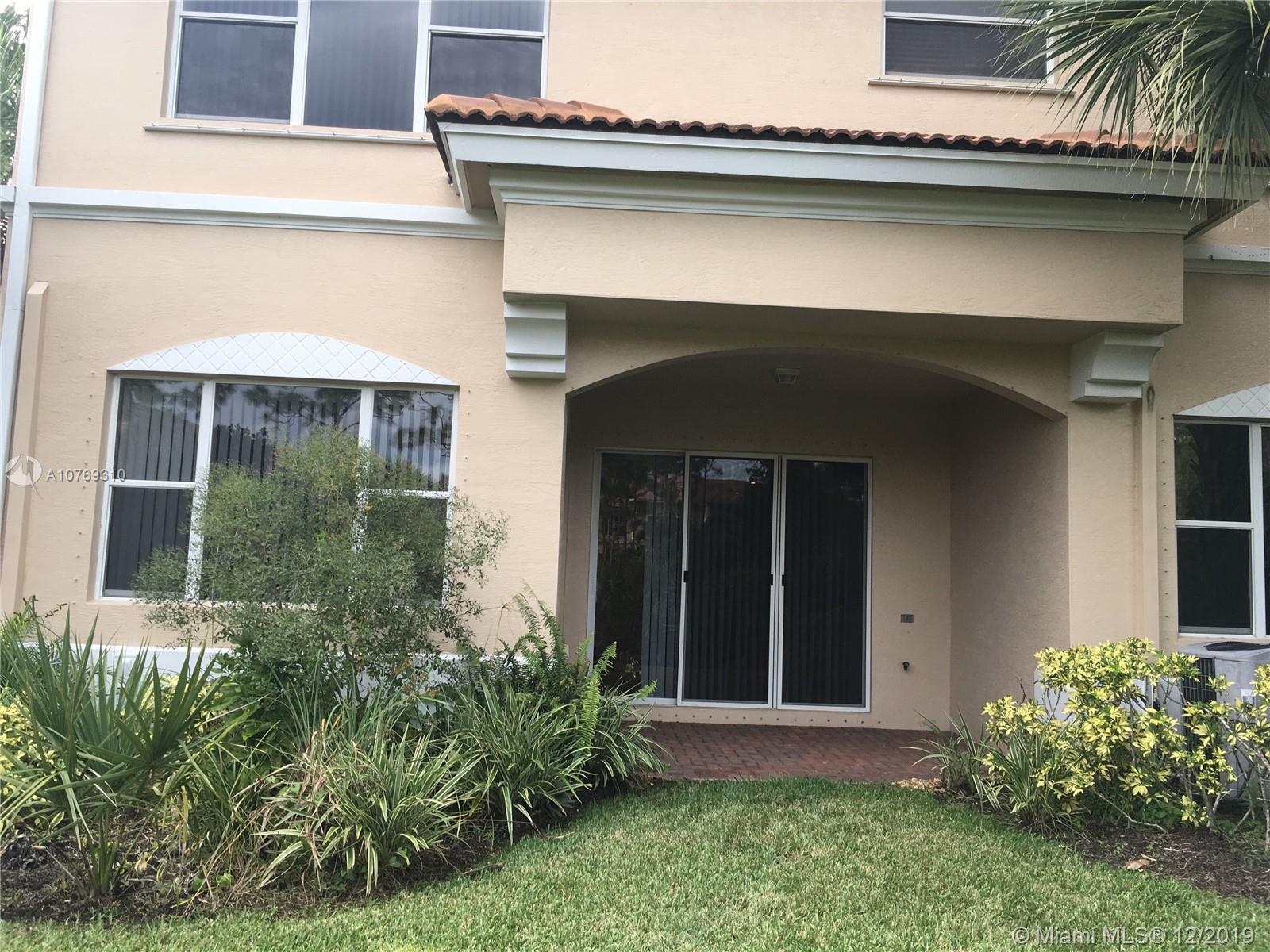 332 Southwest Otter Run Place, Unit 332 Stuart, FL 34997 - Photo 22 of 24 This picture of the back of the townhouse shows how big the windows and patio are.