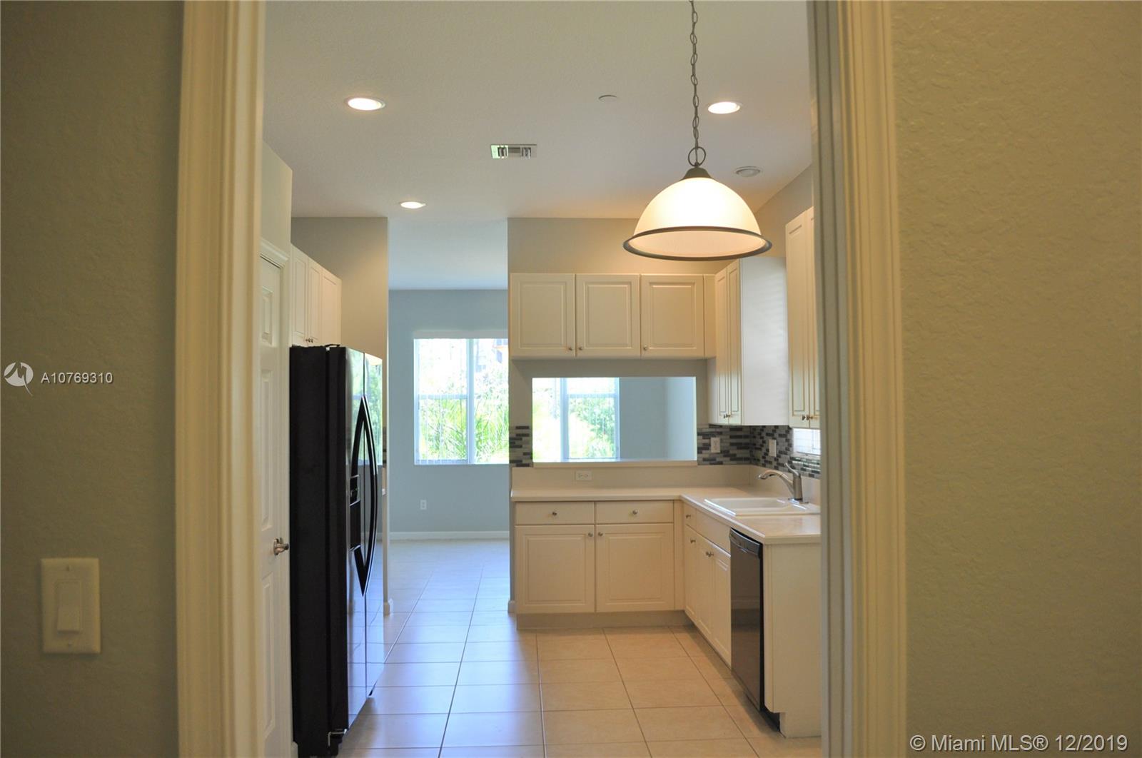 332 Southwest Otter Run Place, Unit 332 Stuart, FL 34997 - Photo 5 of 24 Look at the light and bright kitchen! Lots of cabinets.