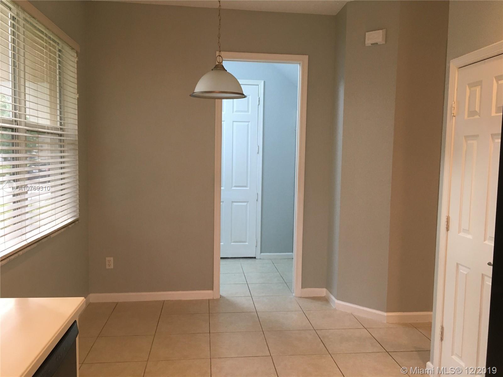 332 Southwest Otter Run Place, Unit 332 Stuart, FL 34997 - Photo 7 of 24 Breakfast nook with room for a large table. Behind that is the separate laundry room.