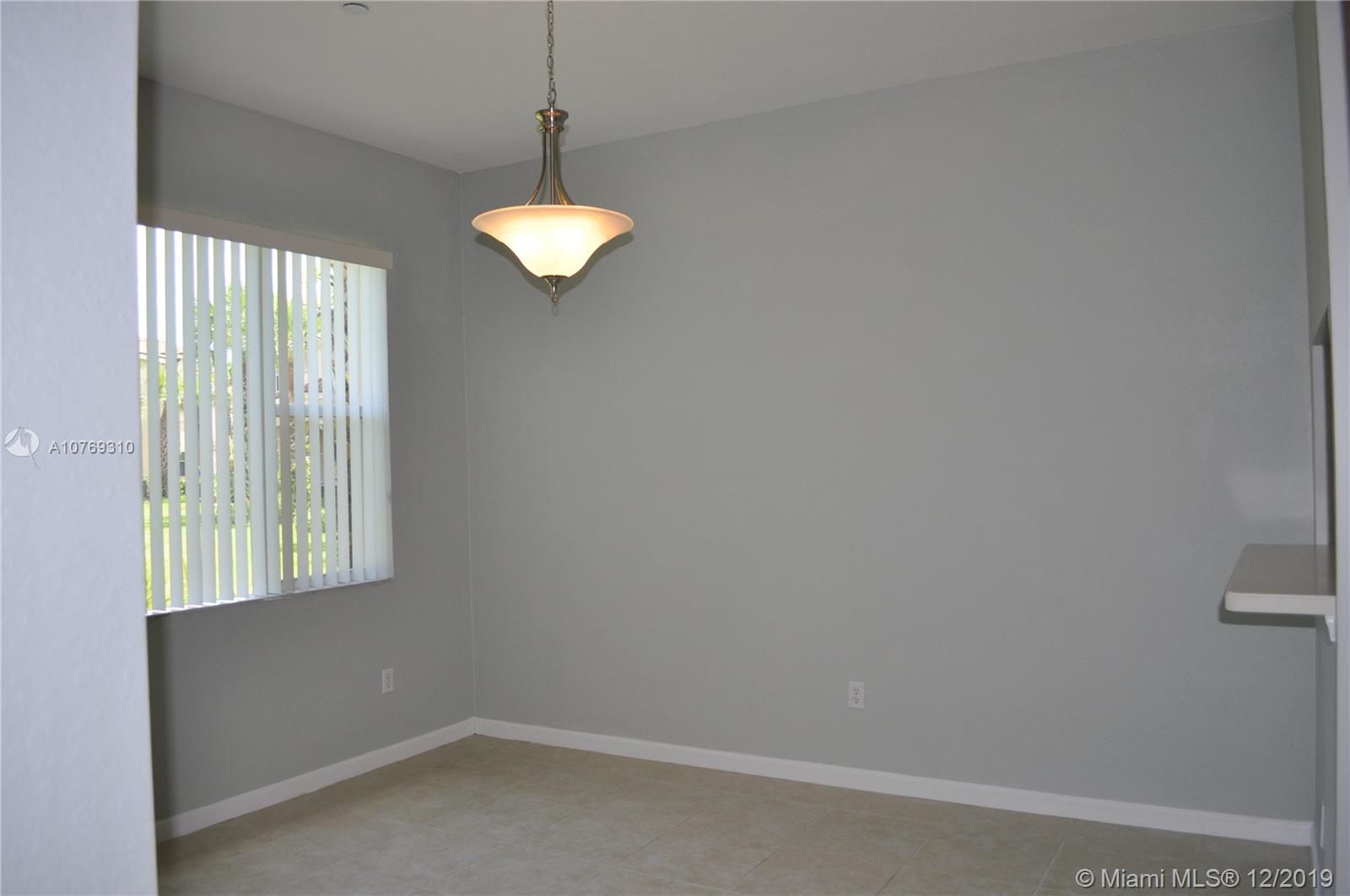 332 Southwest Otter Run Place, Unit 332 Stuart, FL 34997 - Photo 10 of 24 Formal dining room for friends and family.