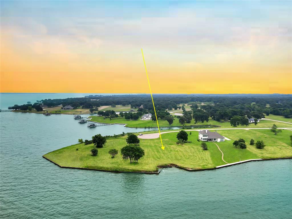 a view of a lake with a yard