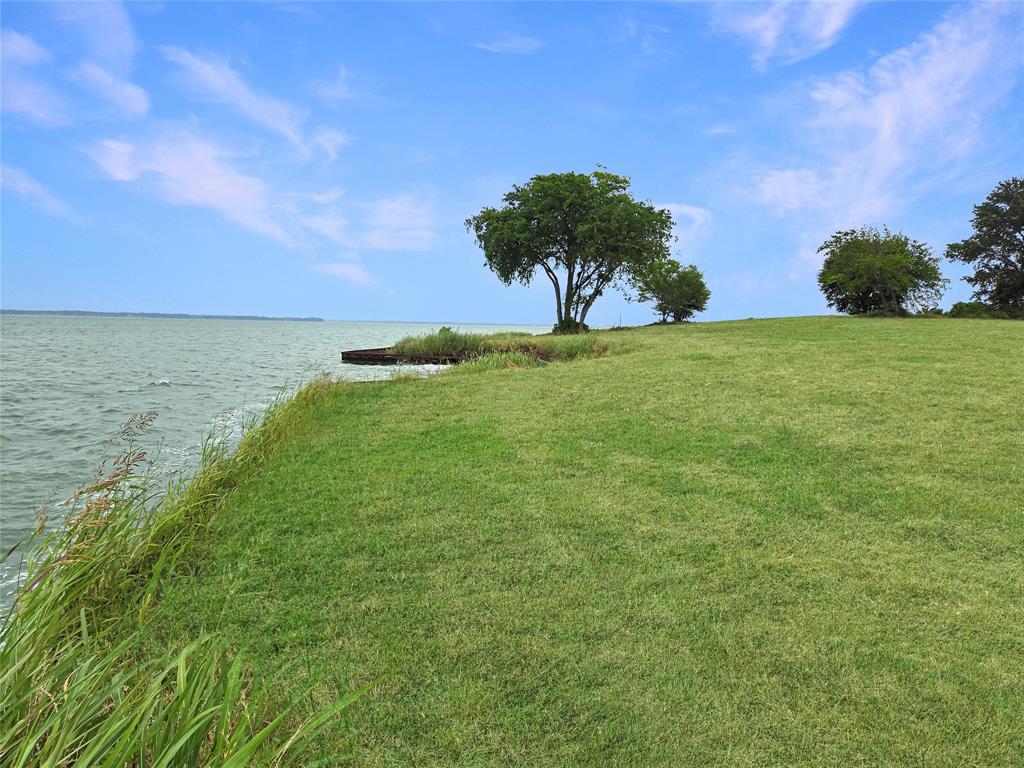 Lot 19 Lake Ridge Drive Streetman, TX 75859 - Photo 11 of 40 a view of a lake with a yard