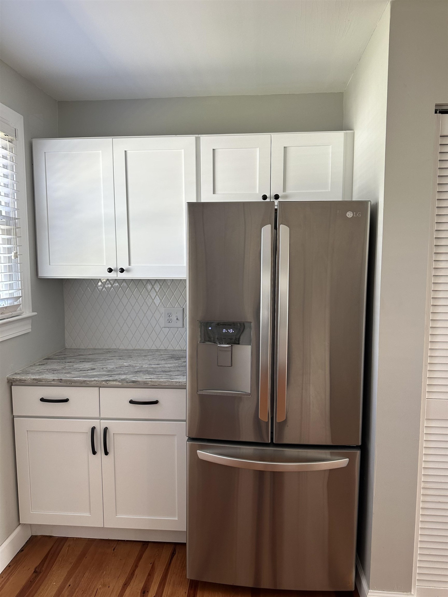 2344 Bernard Street, Unit 3 Raleigh, NC 27608 - Photo 7 of 15 a metallic refrigerator freezer sitting in a kitchen