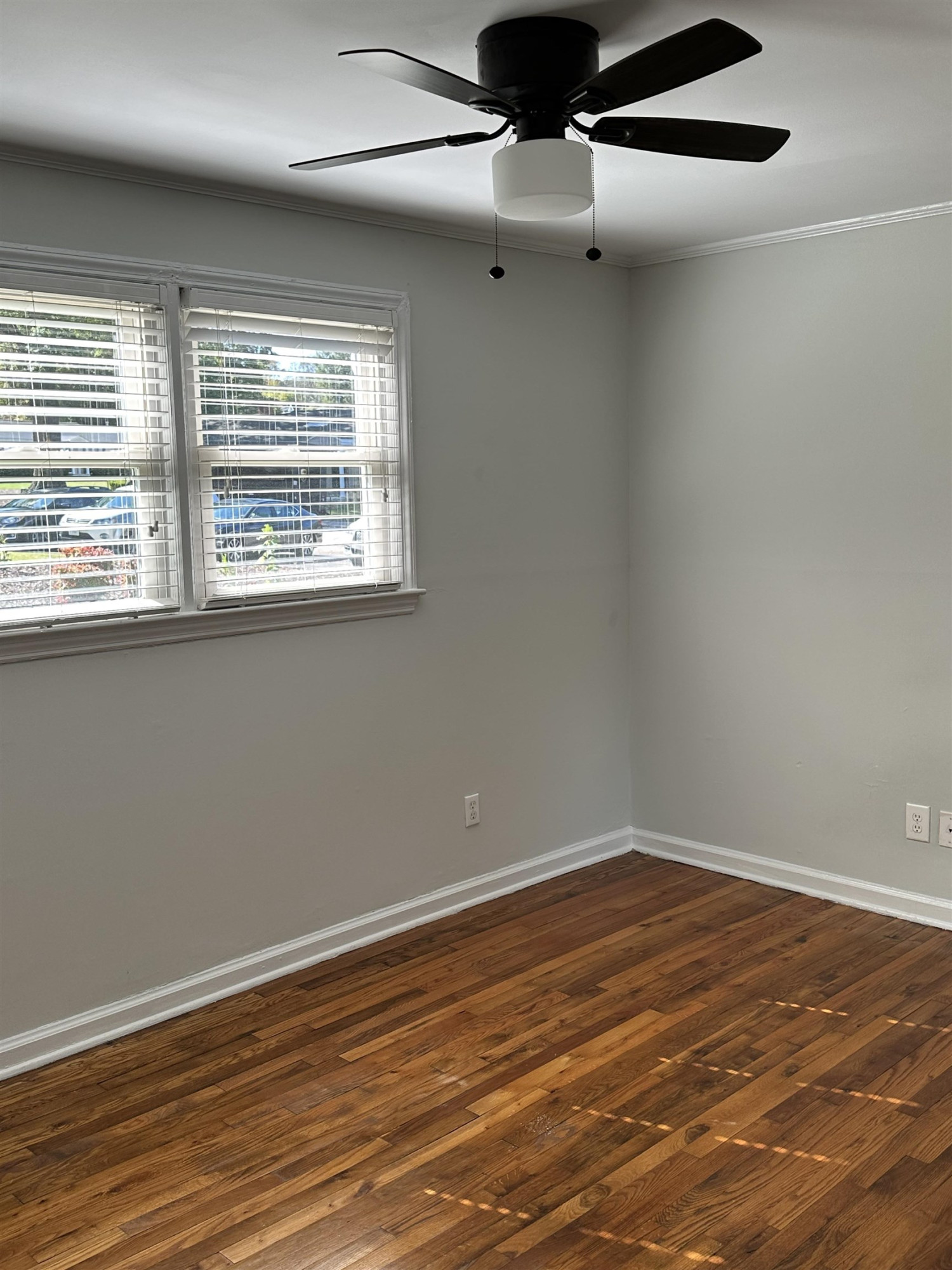 2344 Bernard Street, Unit 3 Raleigh, NC 27608 - Photo 9 of 15 a view of an empty room with wooden floor and a window