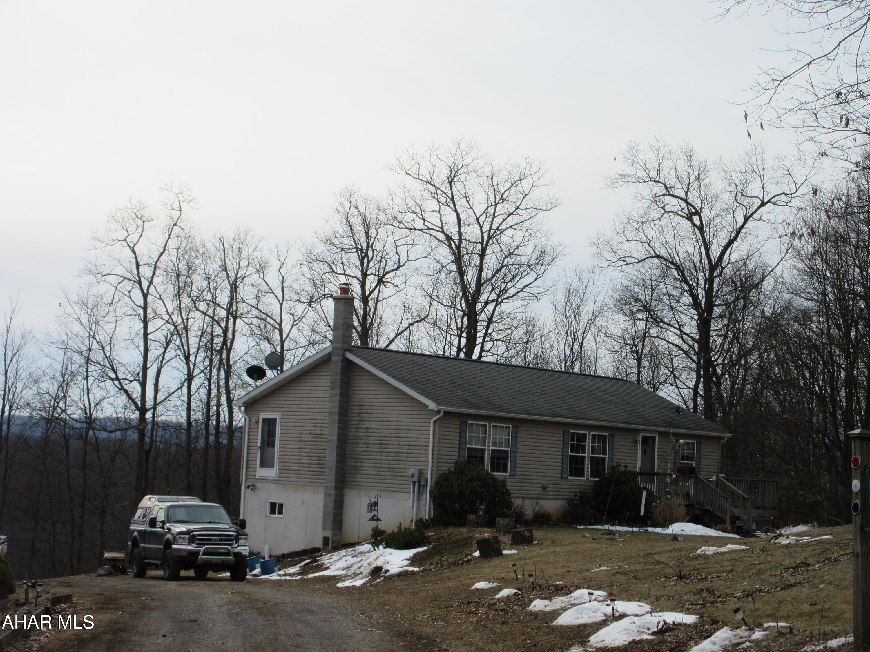 961 Baughman Hollow Road Tyrone, PA 16686 - Photo 2 of 4 a front view of a house with garden