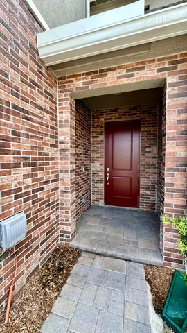 a view of empty room with a fireplace