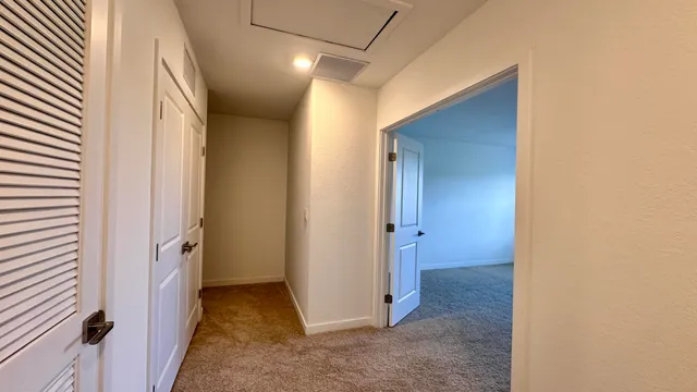a view of a hallway with a room