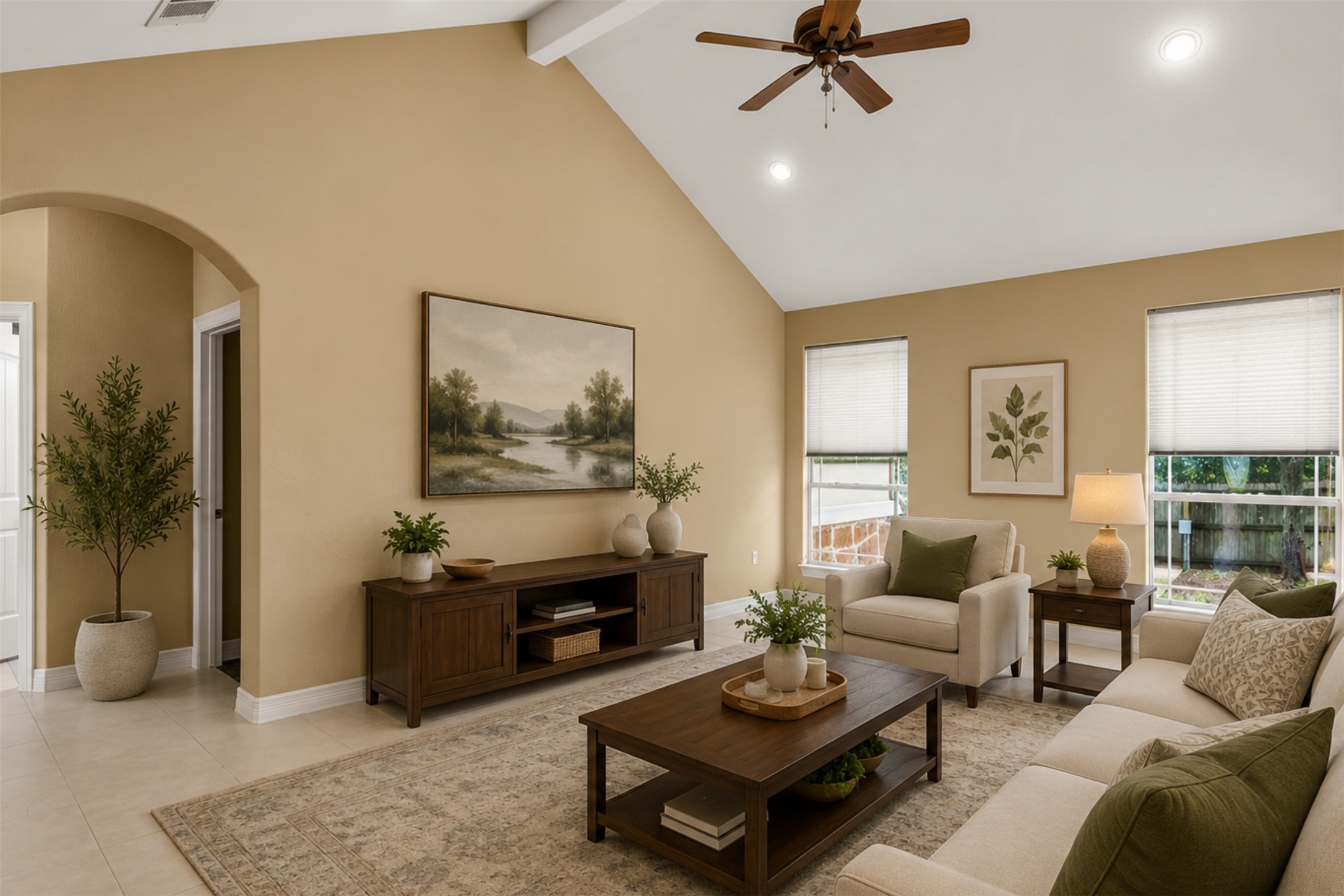437 Balch Road Elgin, TX 78621 - Photo 3 of 37 *Virtually Staged* A vaulted ceiling living room features an inviting atmosphere with a comfortable seating arrangement and bright windows.