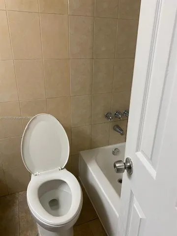 a bathroom with a toilet and a sink