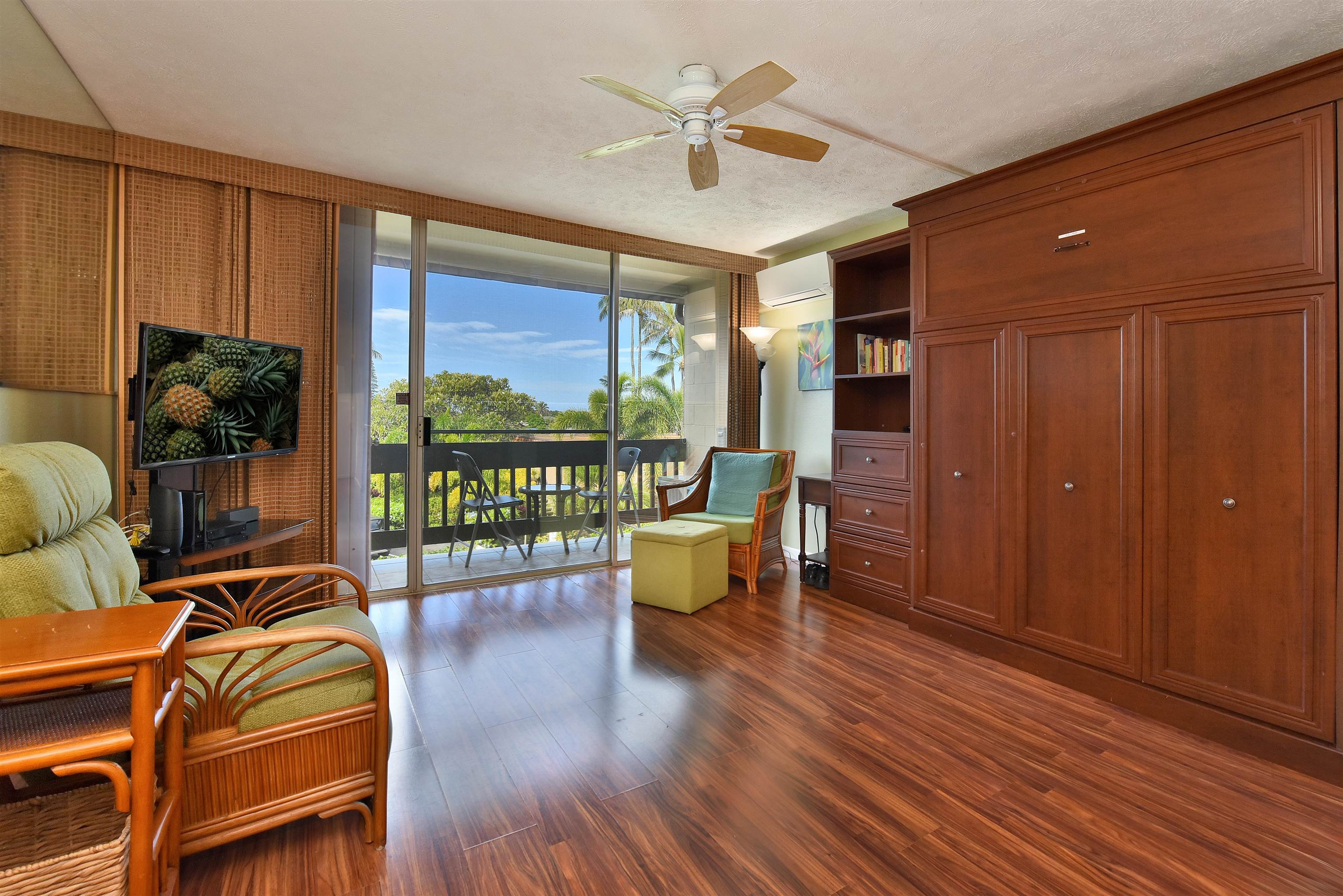120 Hui Rd F, Unit K 11 Lahaina, HI 96761 - Photo 12 of 47 a living room with furniture and a floor to ceiling window