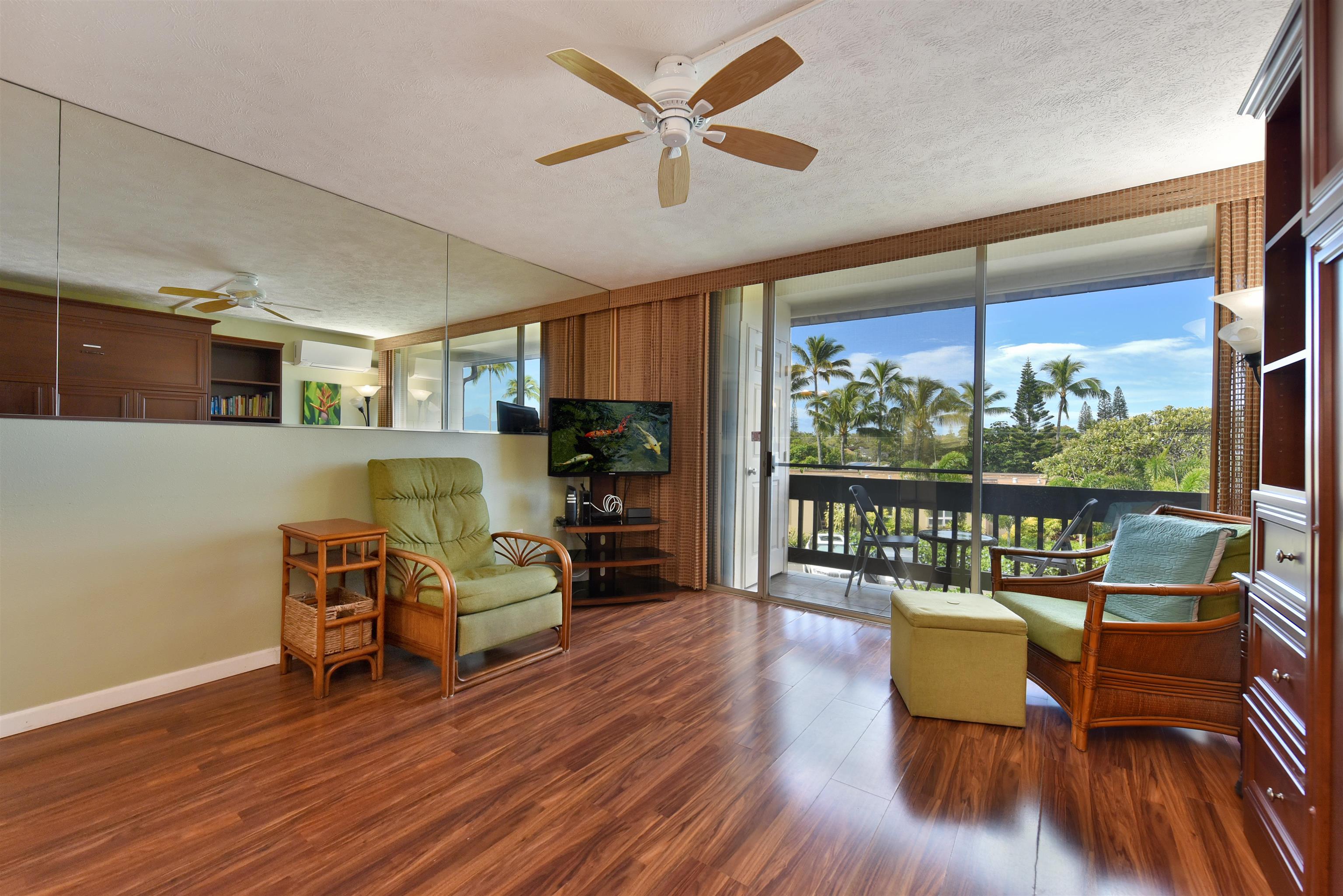 120 Hui Rd F, Unit K 11 Lahaina, HI 96761 - Photo 13 of 47 a living room with furniture and a wooden floor