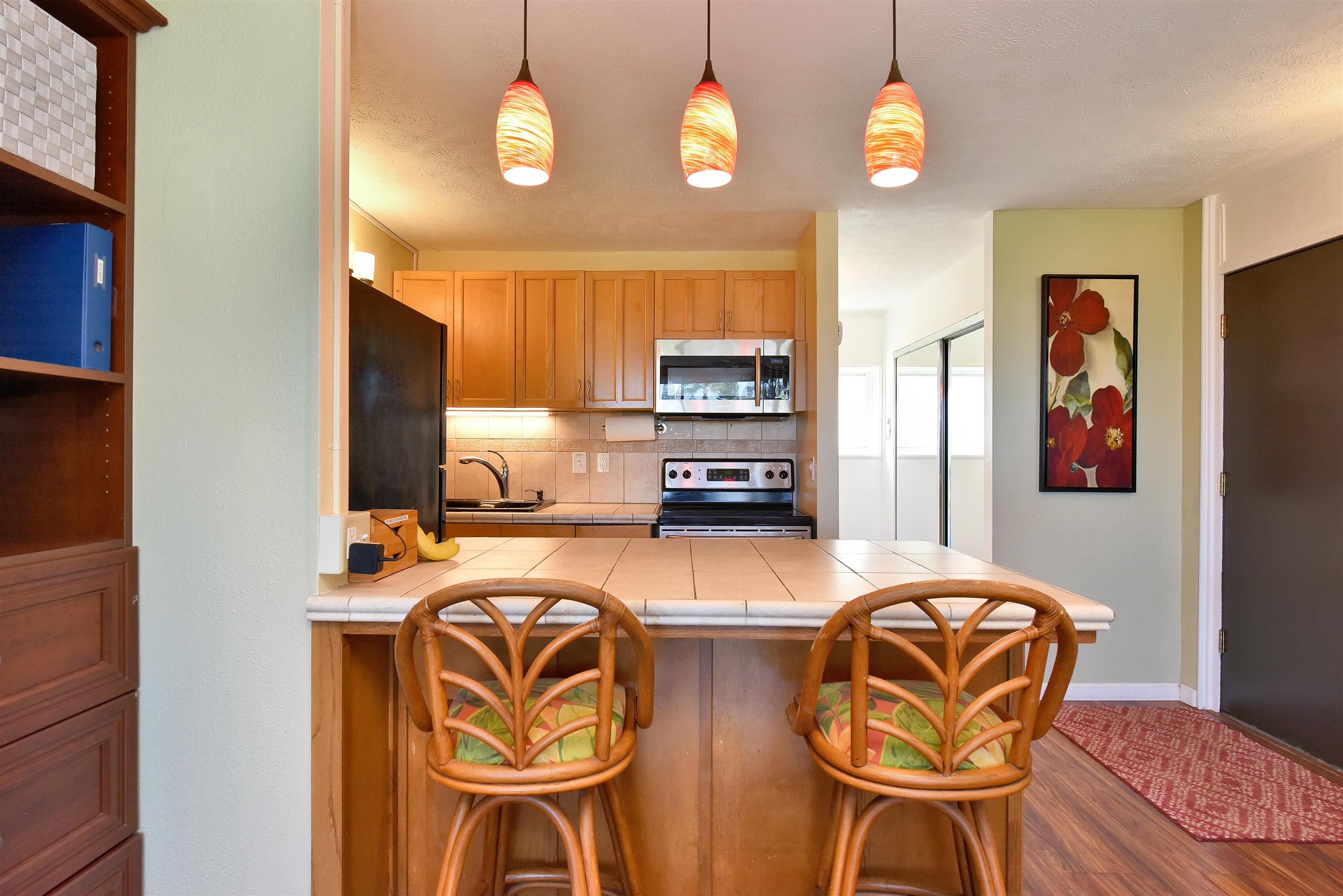 120 Hui Rd F, Unit K 11 Lahaina, HI 96761 - Photo 8 of 47 a view of a dining room with furniture