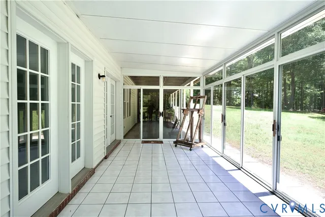a bathroom with a bathtub and a window
