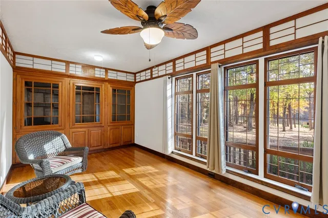 a view of a livingroom with stairs and furniture