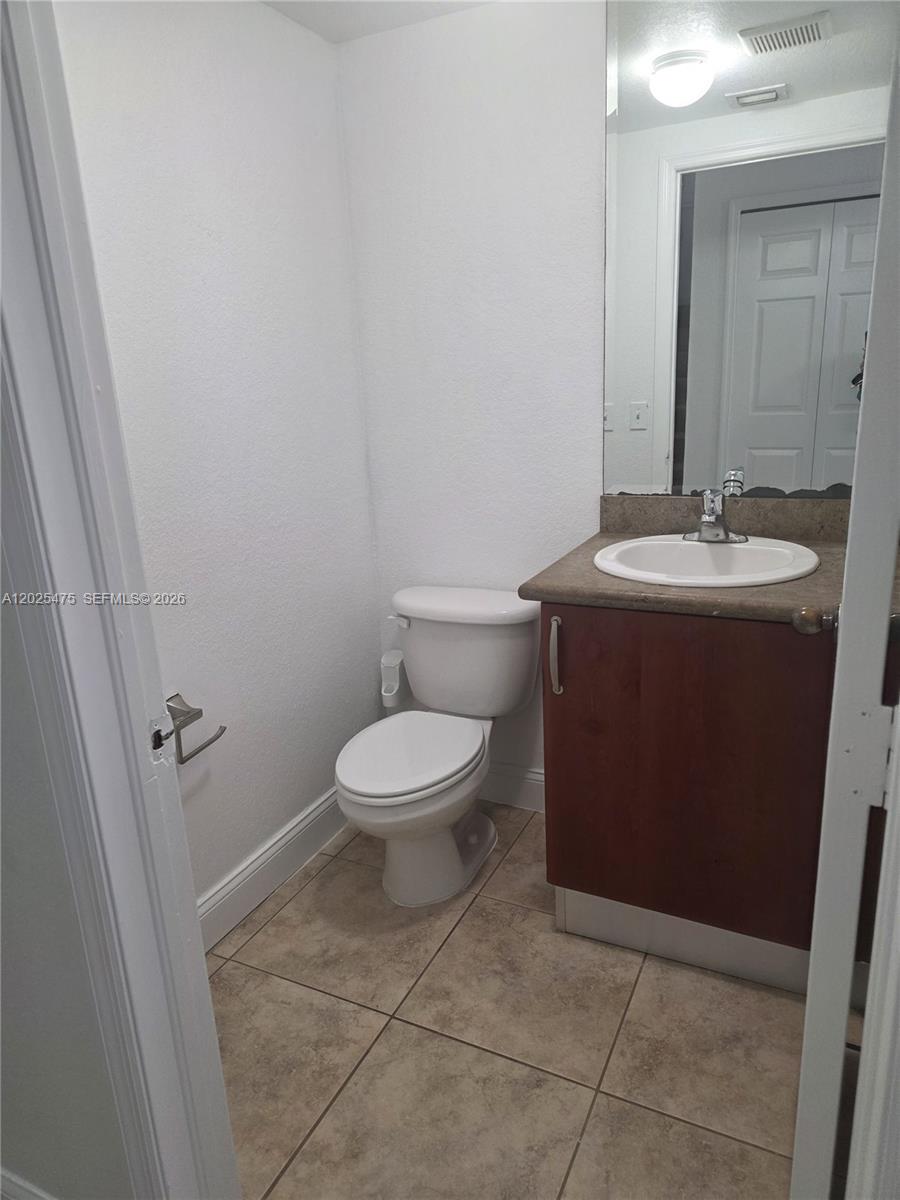 7477 Northwest 181st Street Hialeah, FL 33015 - Photo 4 of 12 half bathroom downstairs