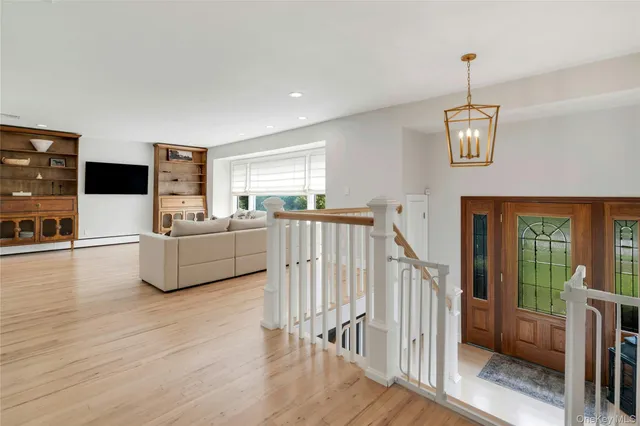 a view of livingroom with furniture wooden floor and windows