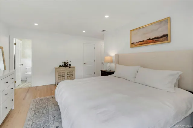 a bedroom with a bed and a couch