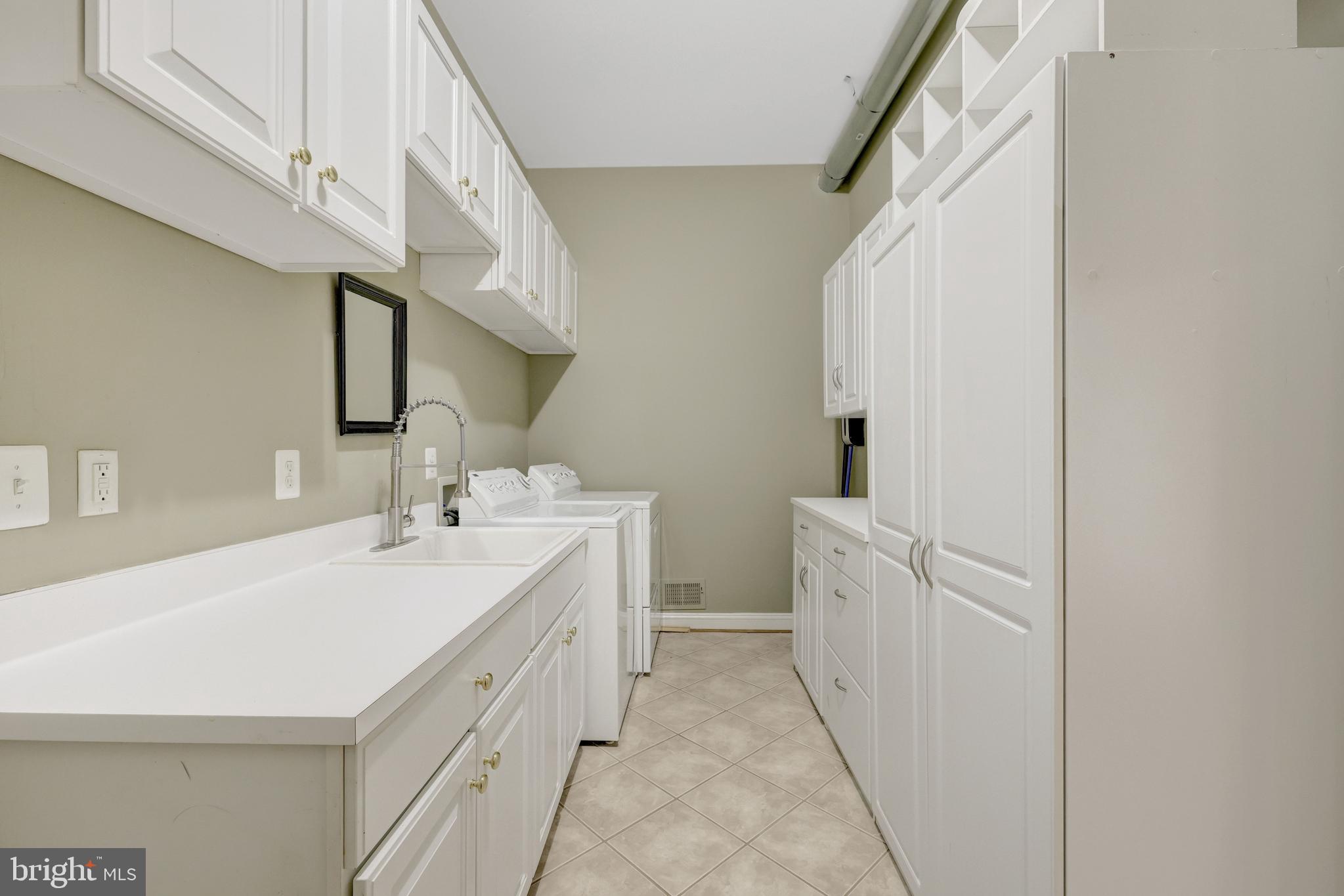 20443 Cliftons Point Street Sterling, VA 20165 - Photo 28 of 37 a spacious bathroom with a double vanity sink and a mirror