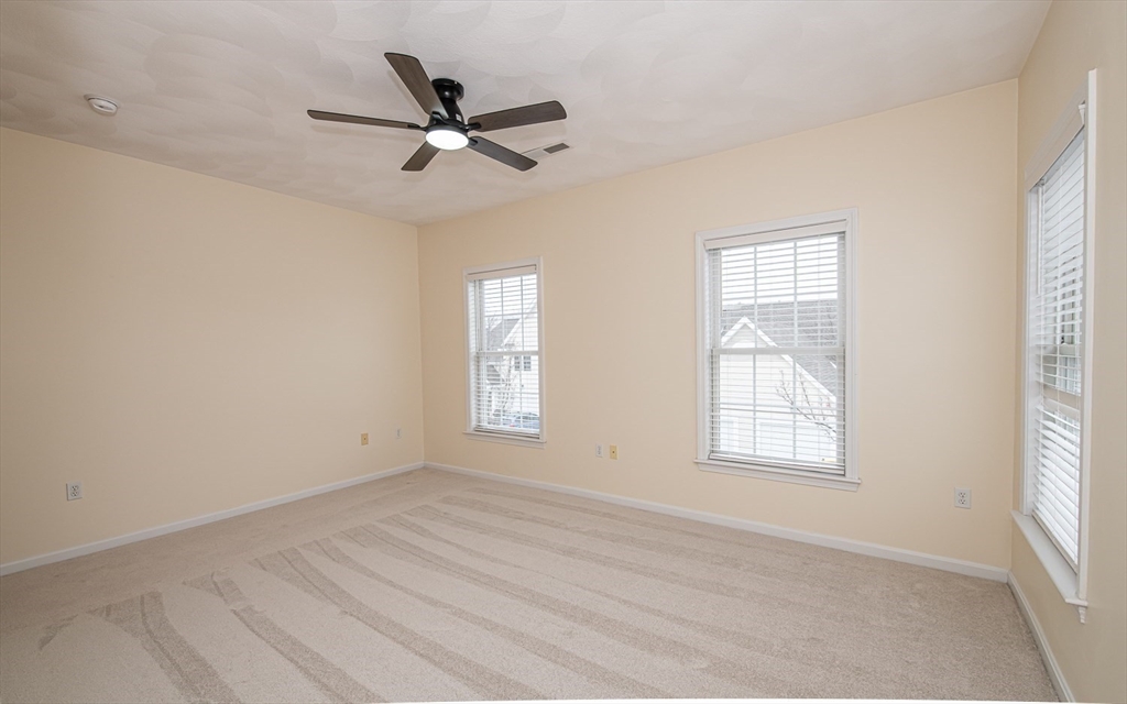 401 Autumn Ridge Drive, Unit 401 Ayer, MA 01432 - Photo 21 of 33 a view of an empty room with a window