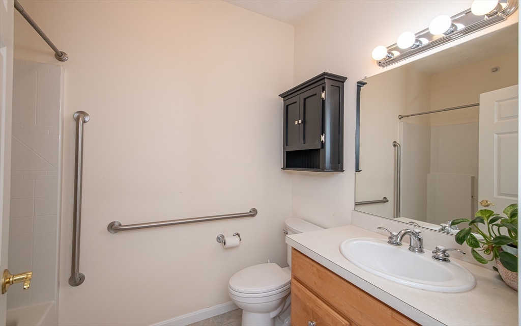 401 Autumn Ridge Drive, Unit 401 Ayer, MA 01432 - Photo 22 of 33 a bathroom with a sink toilet and shower