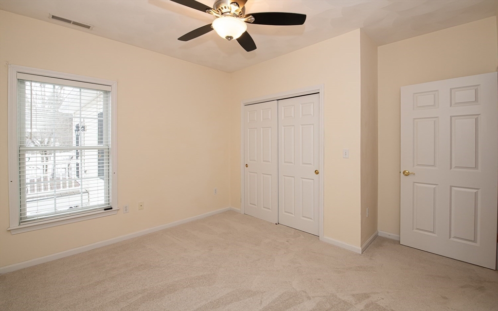 401 Autumn Ridge Drive, Unit 401 Ayer, MA 01432 - Photo 24 of 33 a view of an empty room with a window