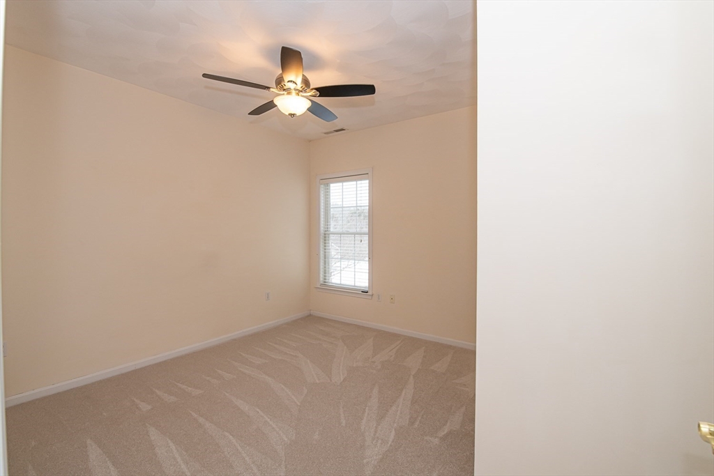 401 Autumn Ridge Drive, Unit 401 Ayer, MA 01432 - Photo 25 of 33 a view of an empty room with a window