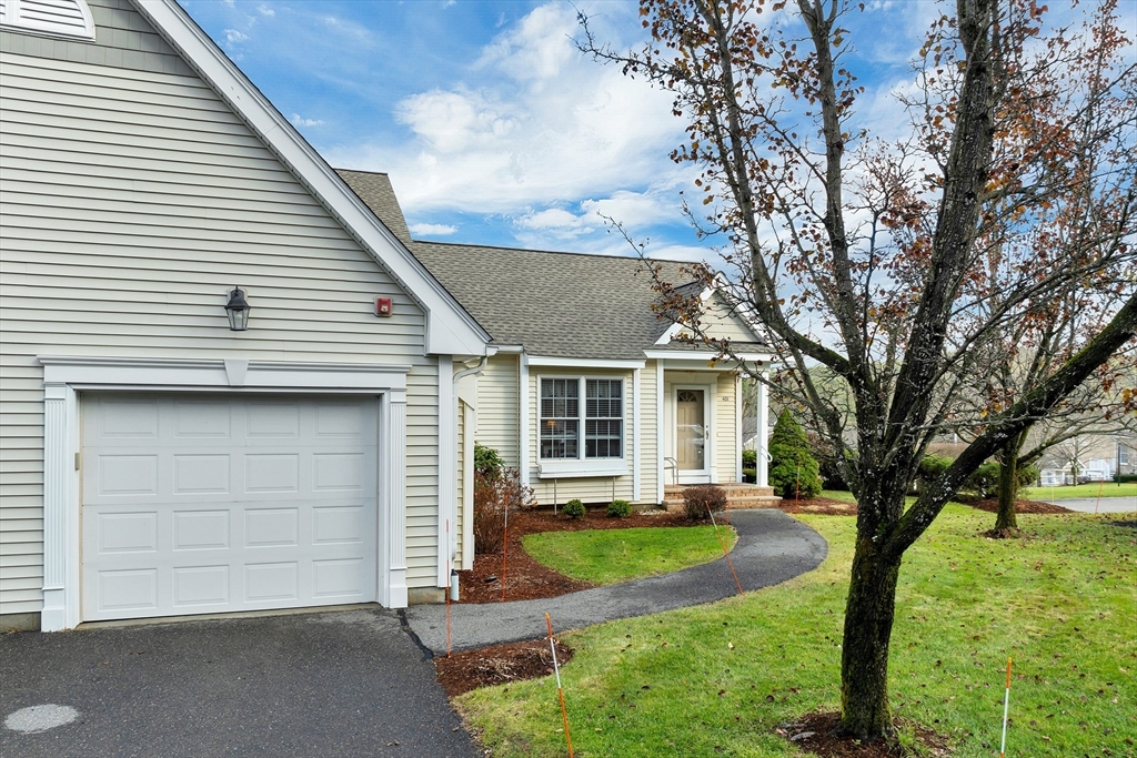 401 Autumn Ridge Drive, Unit 401 Ayer, MA 01432 - Photo 3 of 33 a view of a house with backyard and a tree