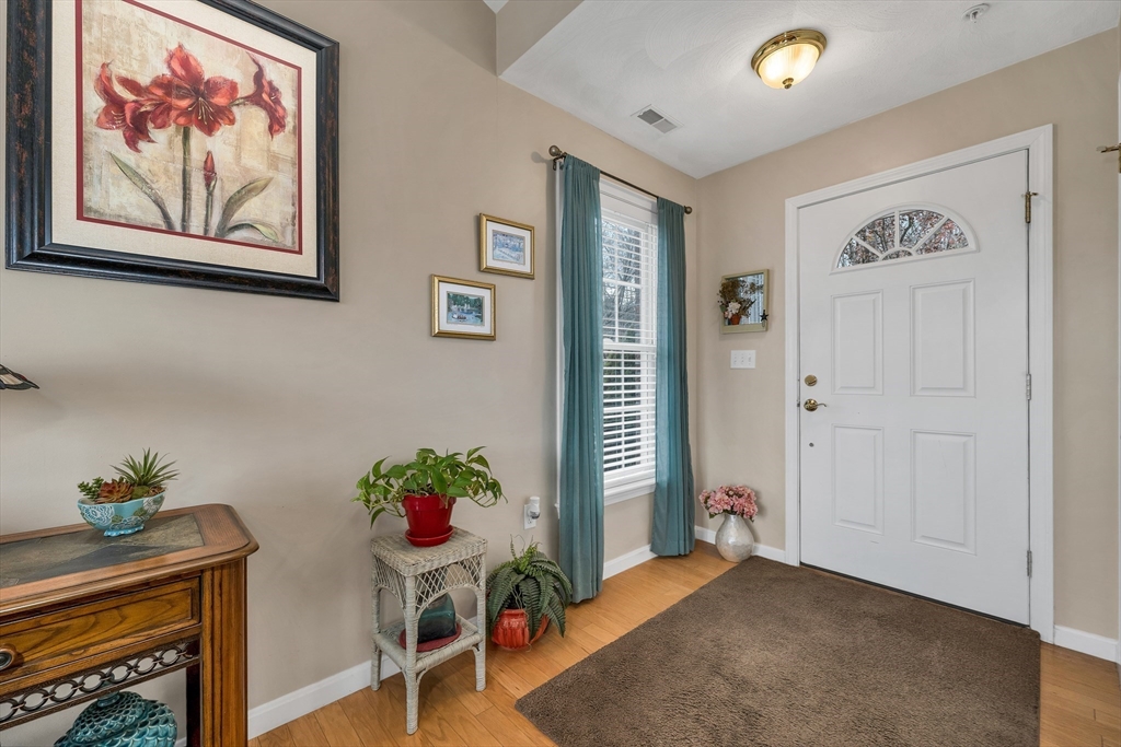 401 Autumn Ridge Drive, Unit 401 Ayer, MA 01432 - Photo 5 of 33 a view of a livingroom with furniture and a potted plant