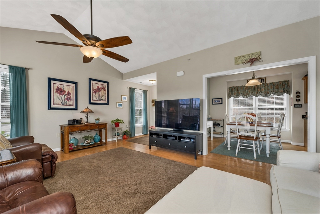 401 Autumn Ridge Drive, Unit 401 Ayer, MA 01432 - Photo 9 of 33 a living room with furniture and a flat screen tv