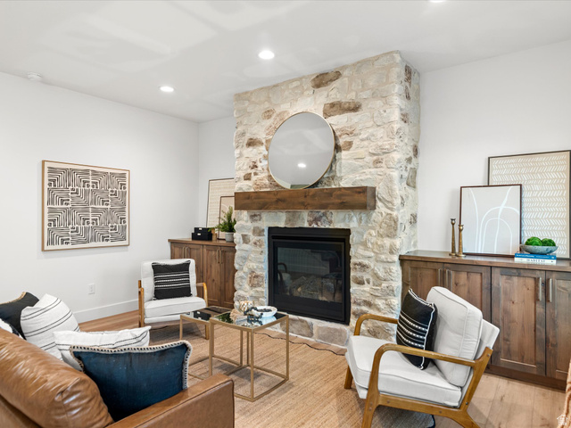 1267 West 2350 South Perry, UT 84302 - Photo 12 of 35 Stone fireplace featuring a wood mantel