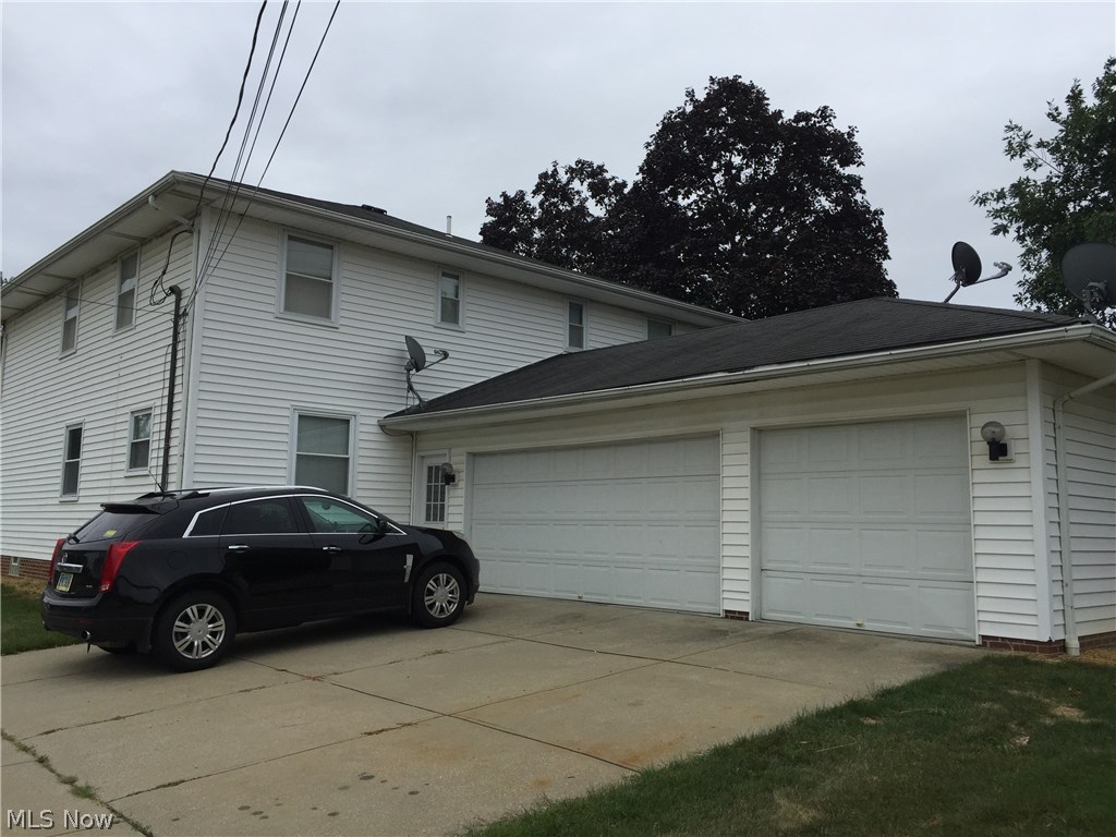 6330-6332 Manchester Road Parma, OH 44129 - Photo 2 of 24 3 Car shared attached garage has interior access from both sides.