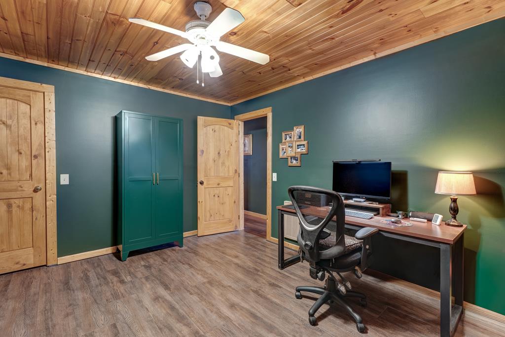 388 Cozy Cove Road Blairsville, GA 30512 - Photo 13 of 44 a view of a workspace with furniture and a window
