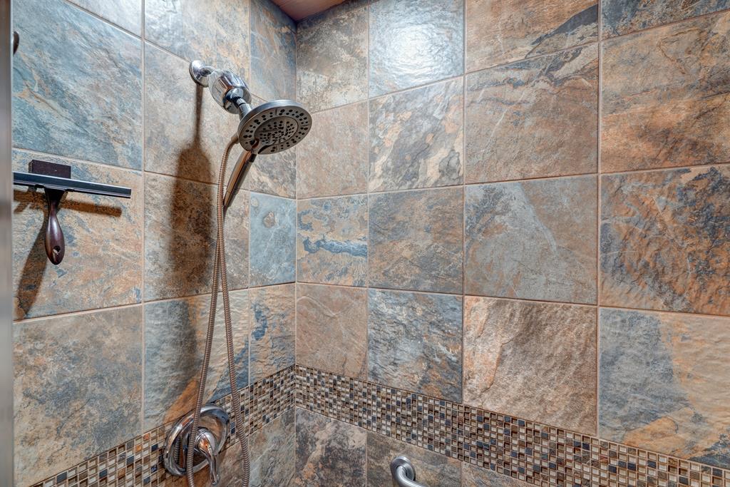 388 Cozy Cove Road Blairsville, GA 30512 - Photo 17 of 44 a bathroom with a shower