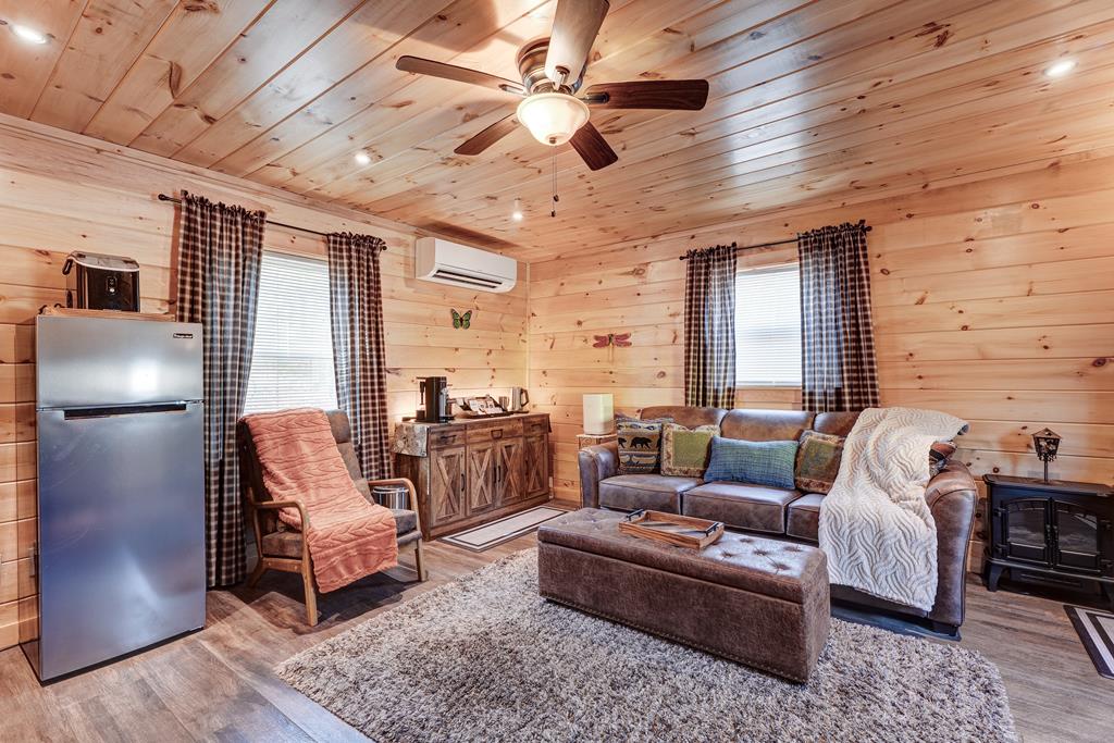 388 Cozy Cove Road Blairsville, GA 30512 - Photo 28 of 44 a living room with furniture and a fireplace