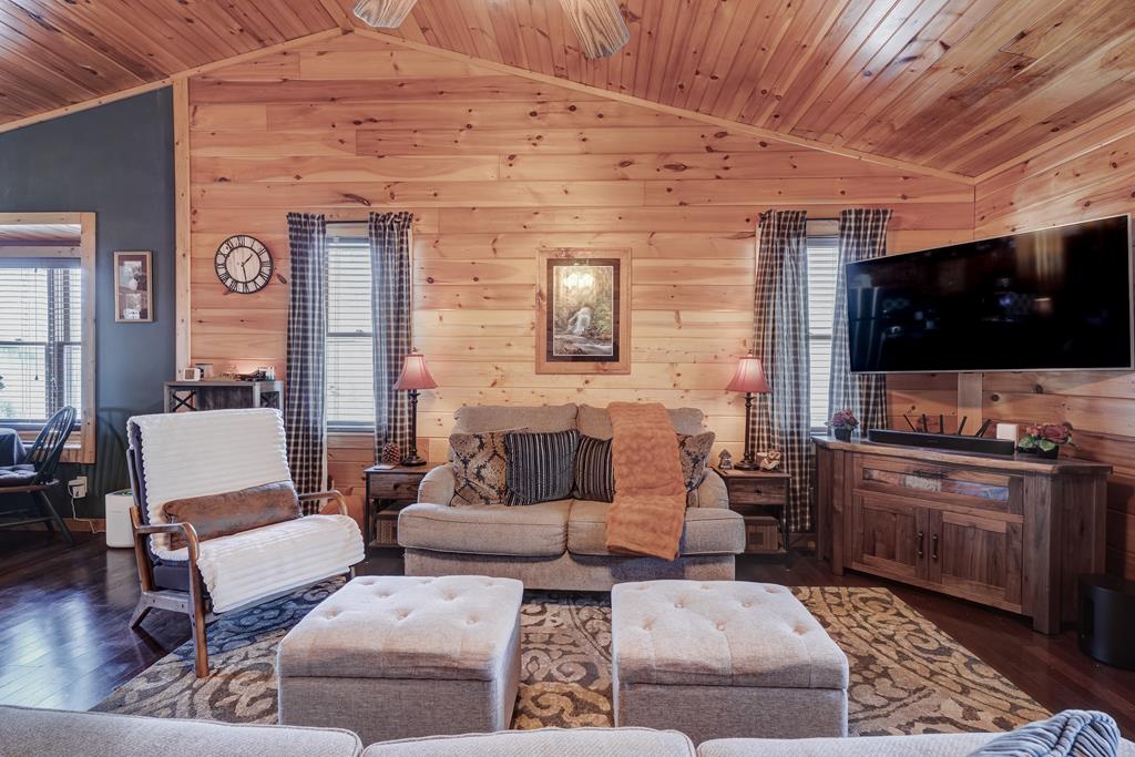 388 Cozy Cove Road Blairsville, GA 30512 - Photo 3 of 44 a living room with furniture and a flat screen tv