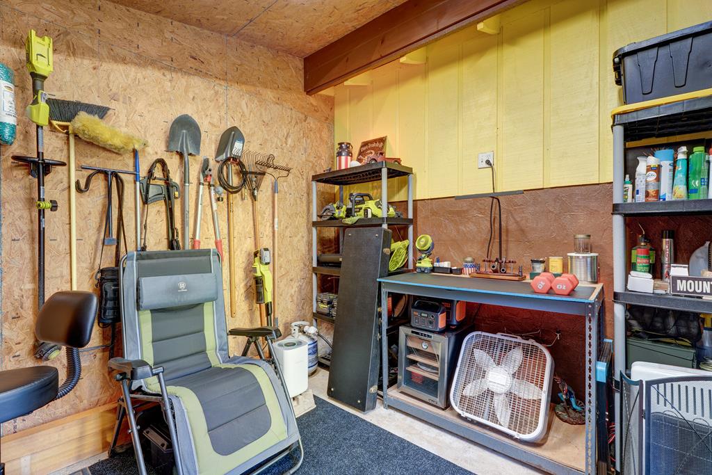 388 Cozy Cove Road Blairsville, GA 30512 - Photo 34 of 44 a bed room with a bed and a book shelf