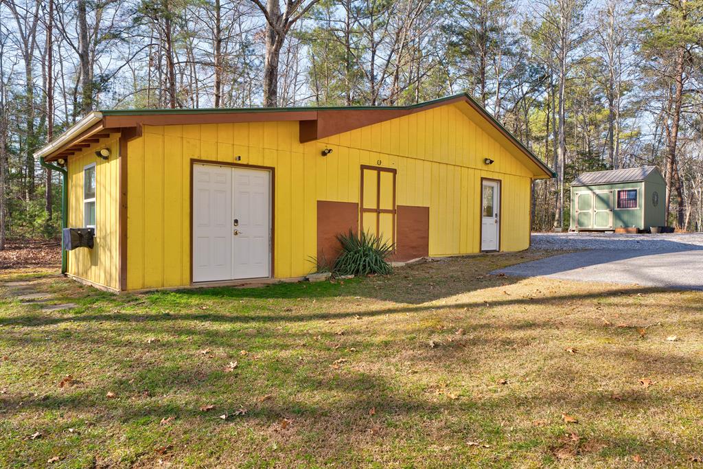388 Cozy Cove Road Blairsville, GA 30512 - Photo 40 of 44 a view of a house with backyard and trees