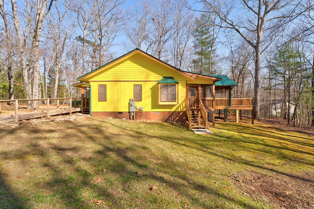 388 Cozy Cove Road Blairsville, GA 30512 - Photo 41 of 44 a view of a house with a yard and large trees