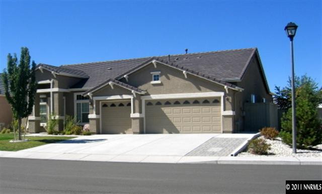 10465 Chantilly Way Reno, NV 89521 - Photo 1 of 1 a front view of a house with a garden