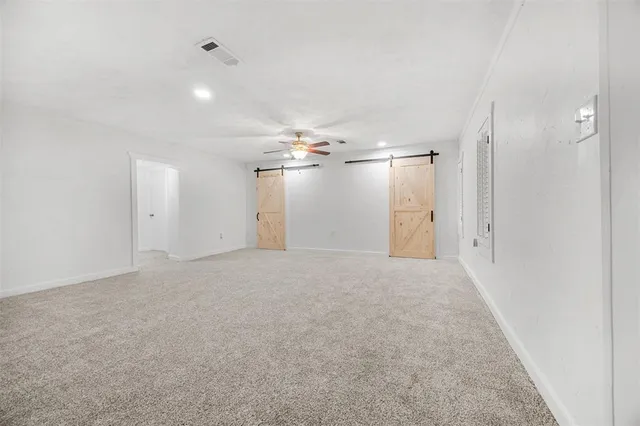 en empty room with an empty space and windows