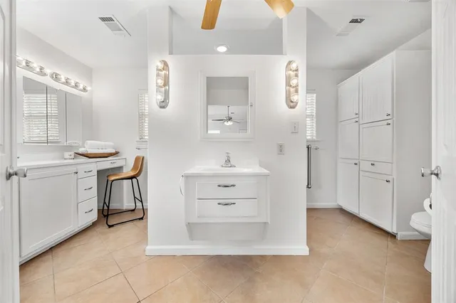 a bathroom with a sink double vanity and a mirror