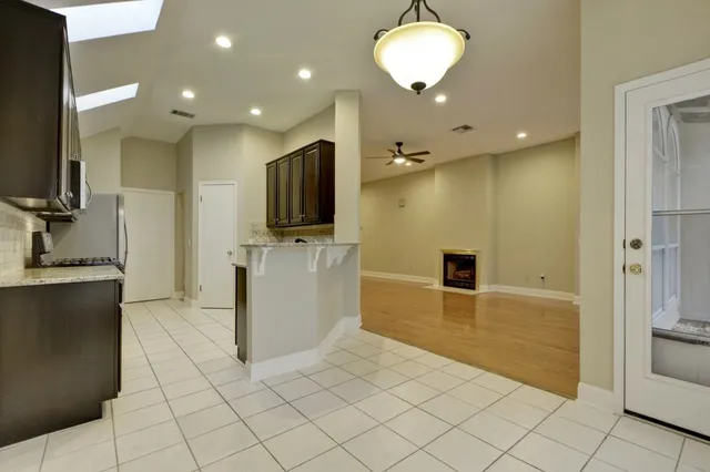 a view of a kitchen with furniture and a flat screen tv