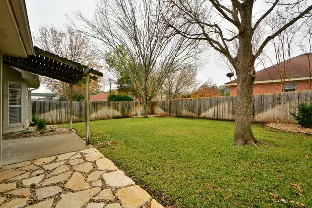 a backyard of a house with lots of green space