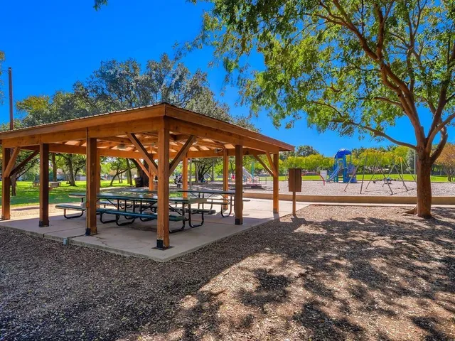 a view of outdoor space with garden and trees