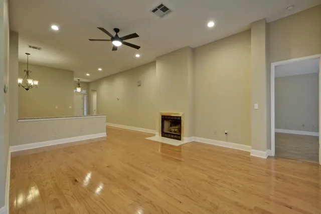 a view of an empty room with a fireplace