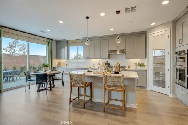 a kitchen with a table and chairs in it